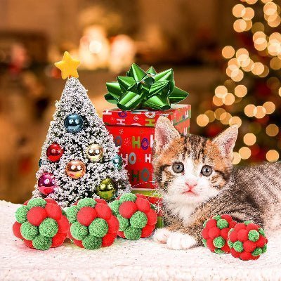 jouet chat chaton entouré balles et cadeaux noel