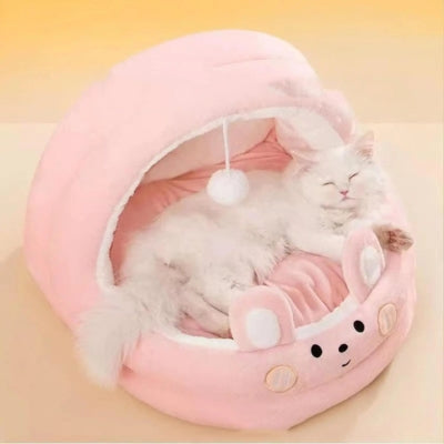 chat dort paisiblement dans niche chat intérieur rose