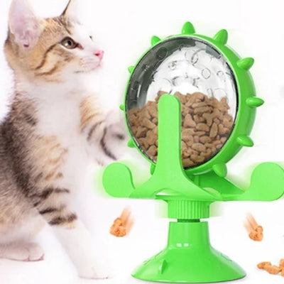 jouet chat interactif vert chaton tendant patte vers distributeur friandises