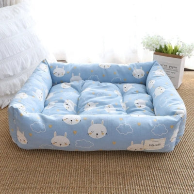 un des coussins chats duoconfort bleu face tissu vichy