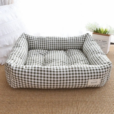 un des coussins chats duoconfort vert foné face tissu vichy